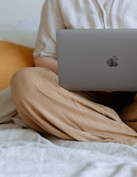 Woman in Bed On Her Laptop